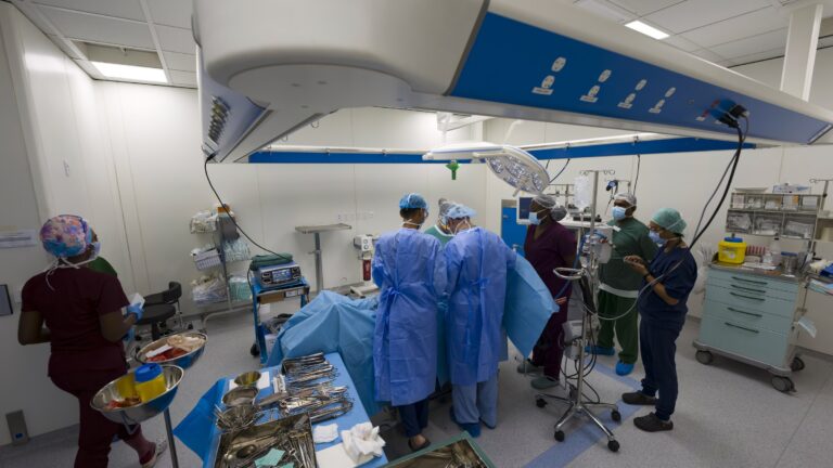 Surgical team at work in a modern operating theatre